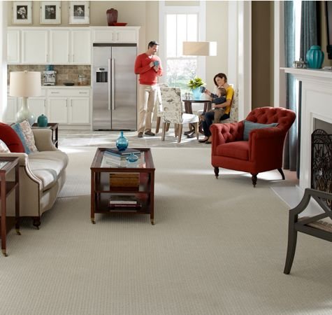 family sitting at table in living room